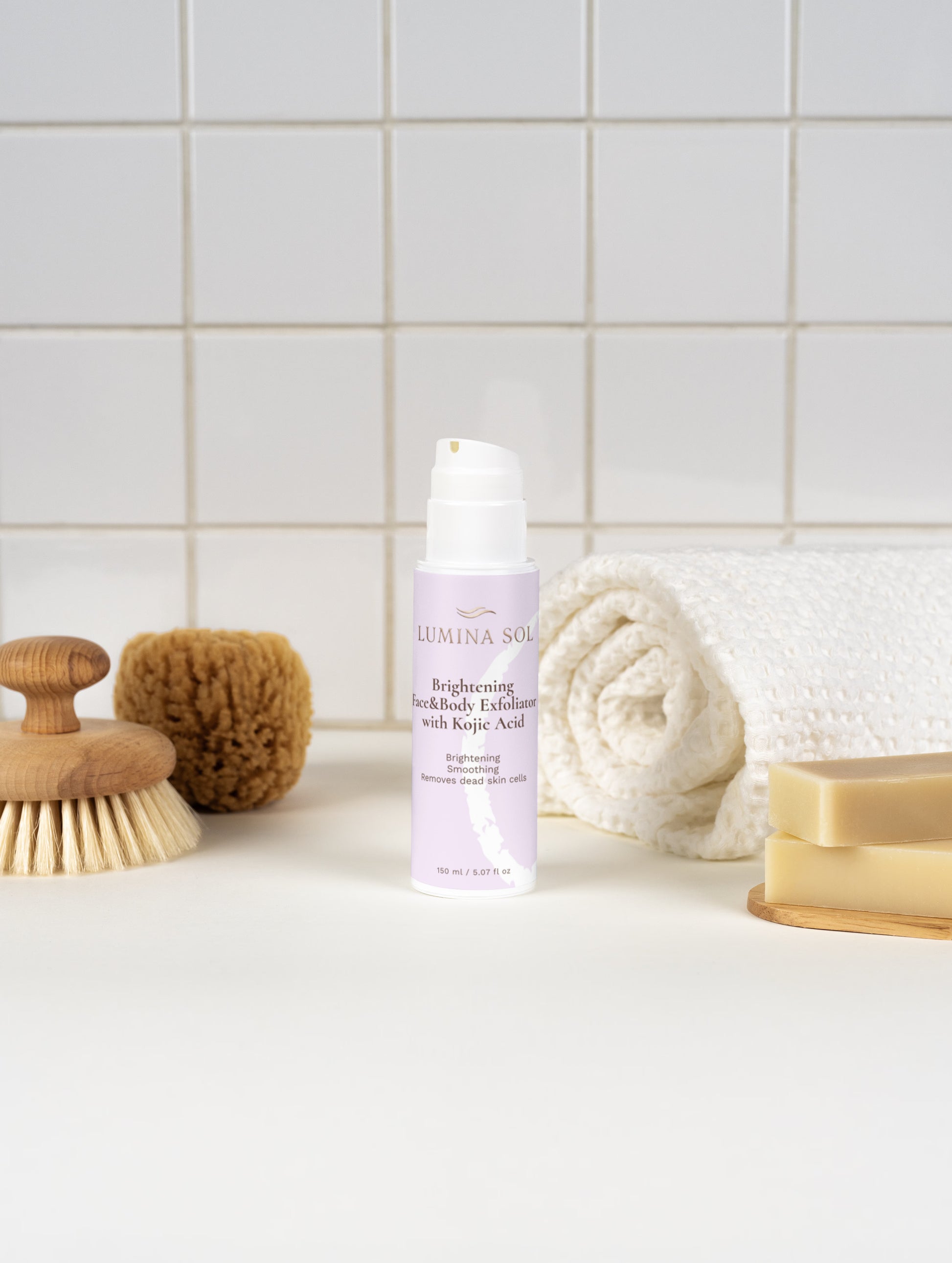 Kojic Acid Exfoliator — close-up of cream texture on fingertip