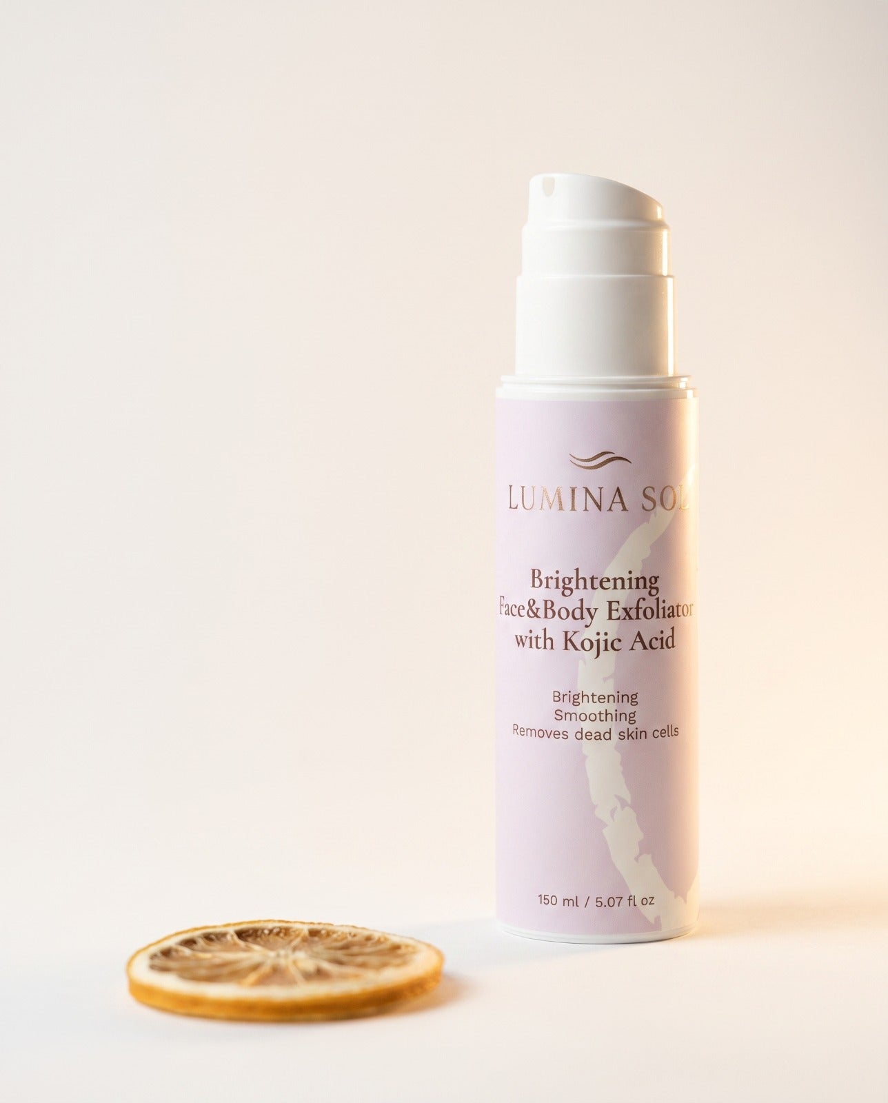 Brightening Exfoliator — lifestyle shot on marble surface with eucalyptus	