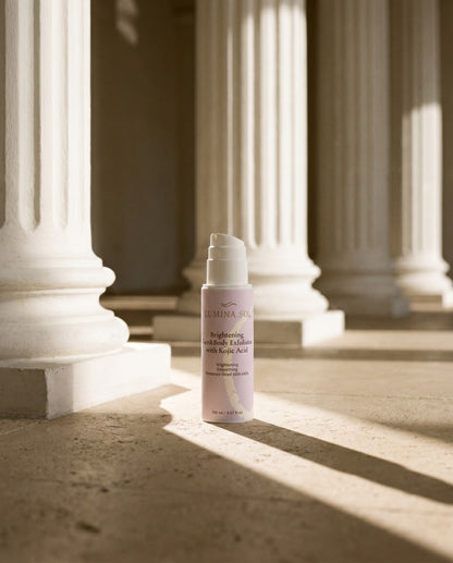 Brightening Face and Body Exfoliator — flat lay with natural botanicals	