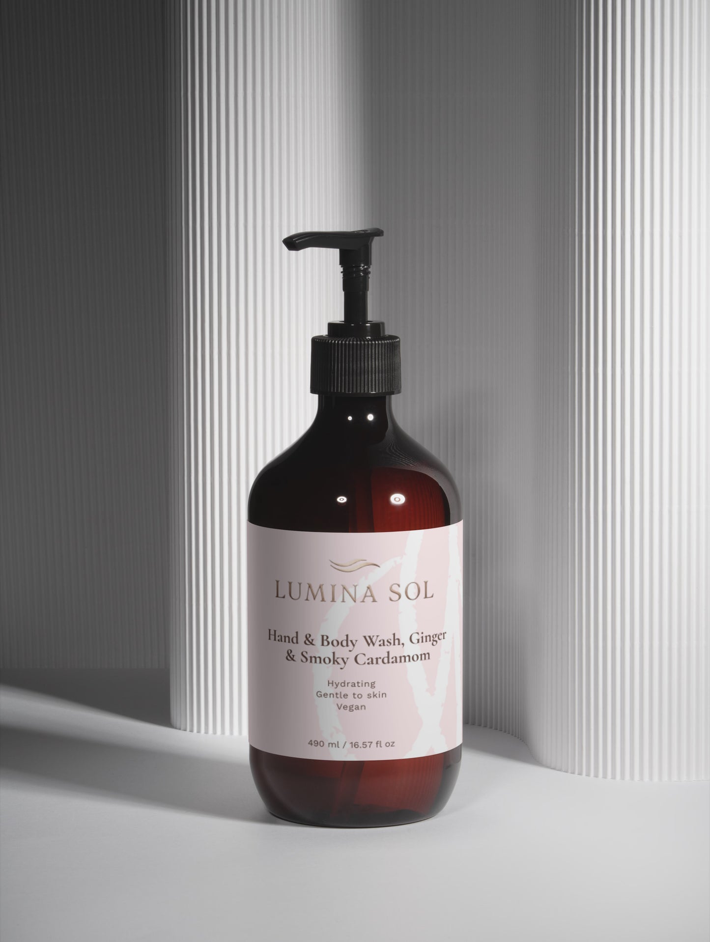 Ginger Smoky Body Wash — lifestyle shot near sink with natural light