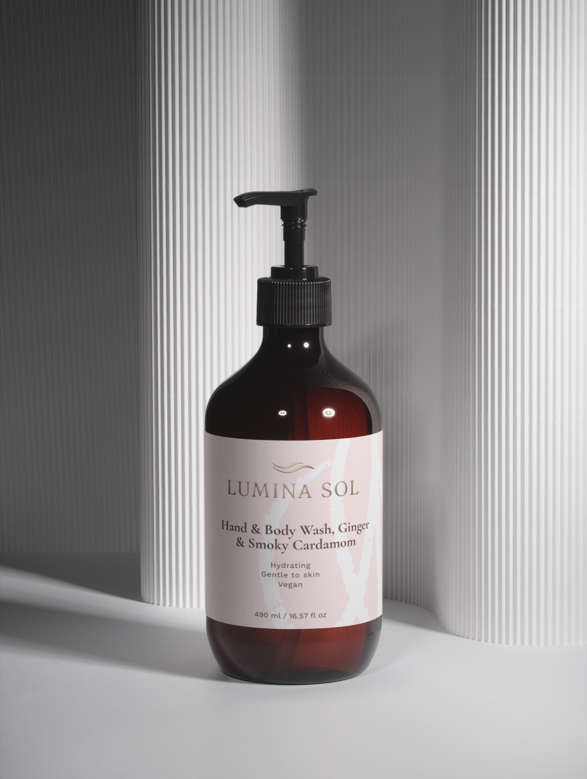 Ginger Smoky Body Wash — lifestyle shot near sink with natural light