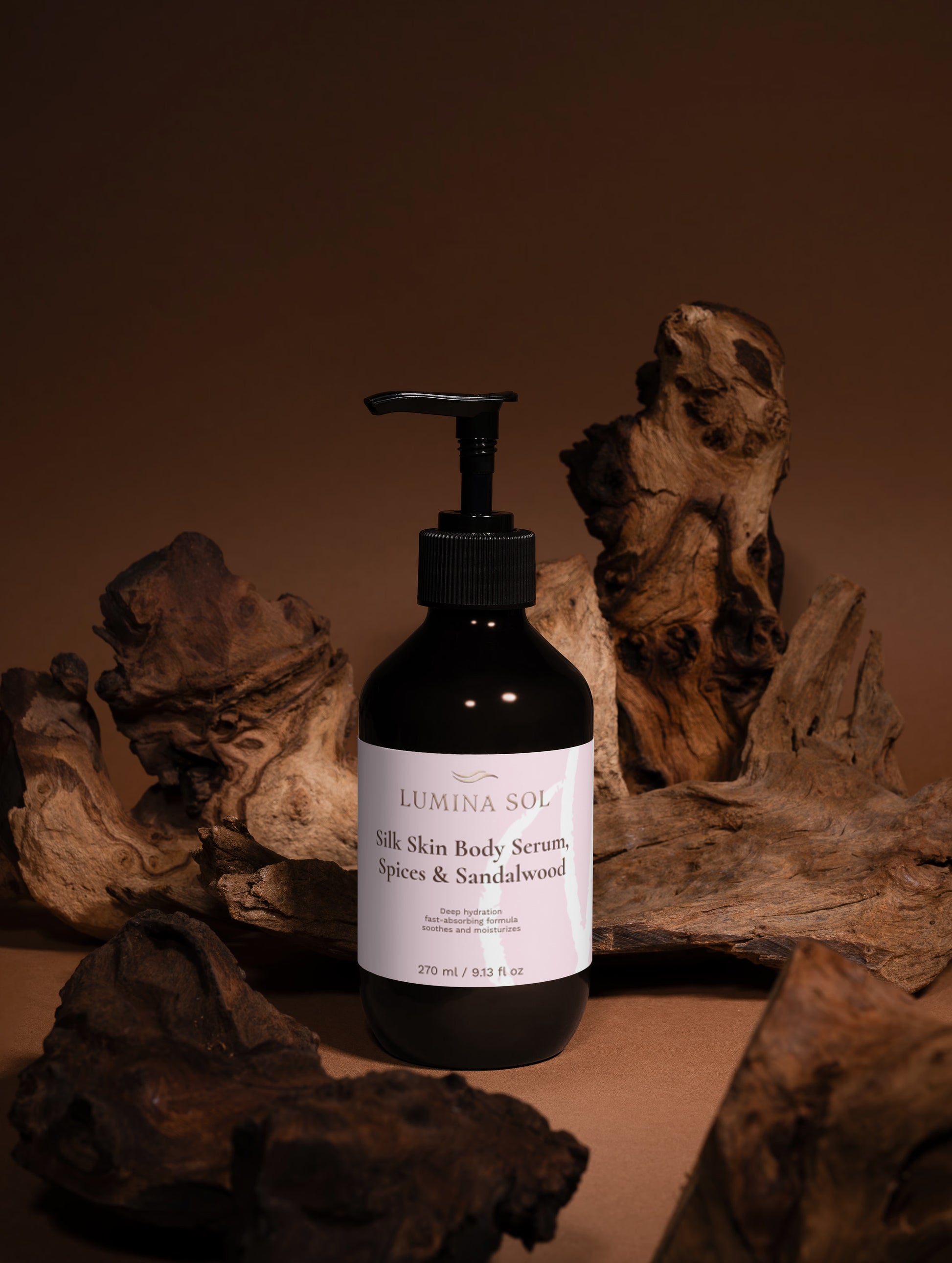 Sandalwood Body Serum — lifestyle shot on wooden tray with spices