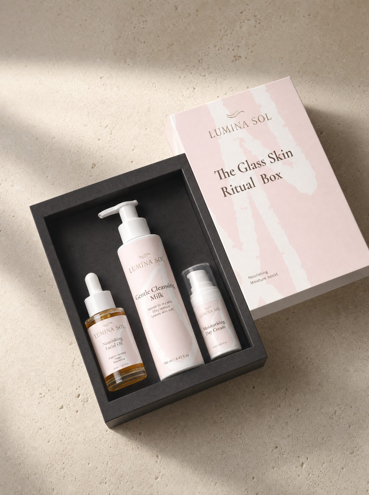 The Glass Skin Ritual Box — all three products on marble surface